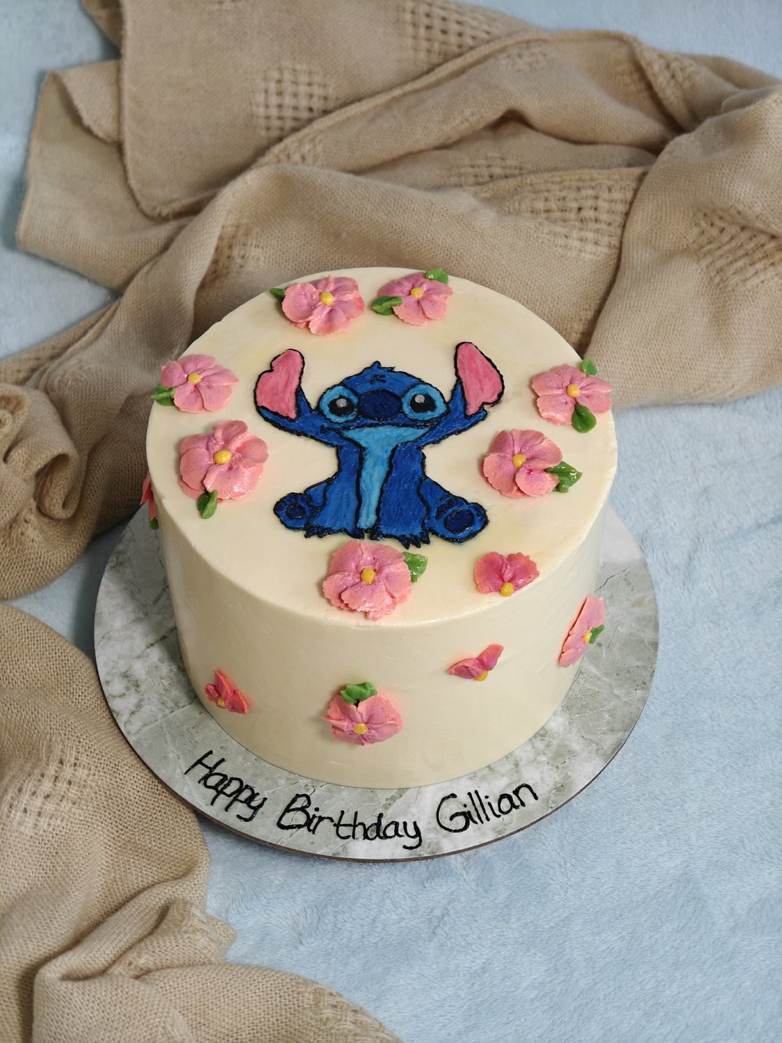 Lilo and Stitch birthday cake — hand-painted Stitch in vibrant blue